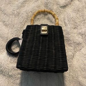 black purse with bamboo handles and hand made material